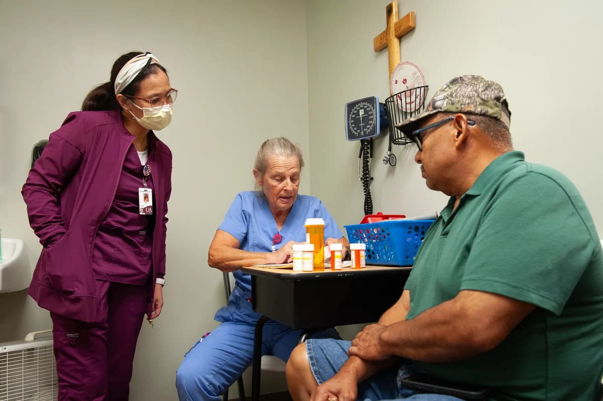 Nursing student May Emphasis, left, and RN Lorie LeJeune, sort through patient Eduardo Navarreteâs prescriptions at a medical clinic provided free of charge to local residents in Hope, Ark. on Sept. 7, 2023. Photo by Rory Doyle.